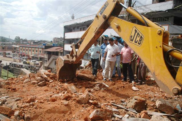demolition drive in Madikeri (Small) Demolition Drive in full swing at Madikeri