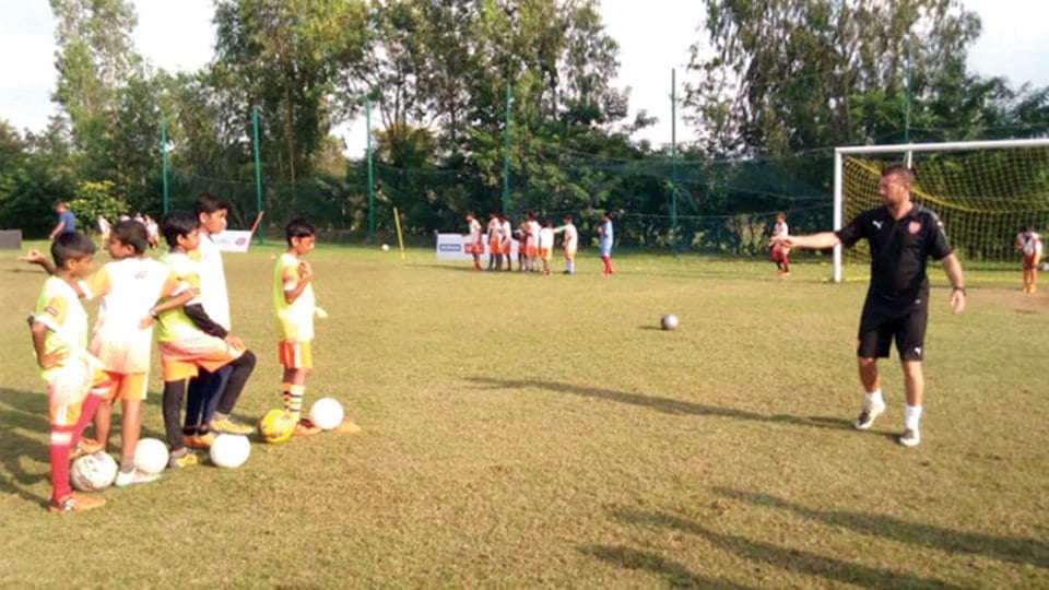 Ian Selley imparts training to Coorg's budding footballers